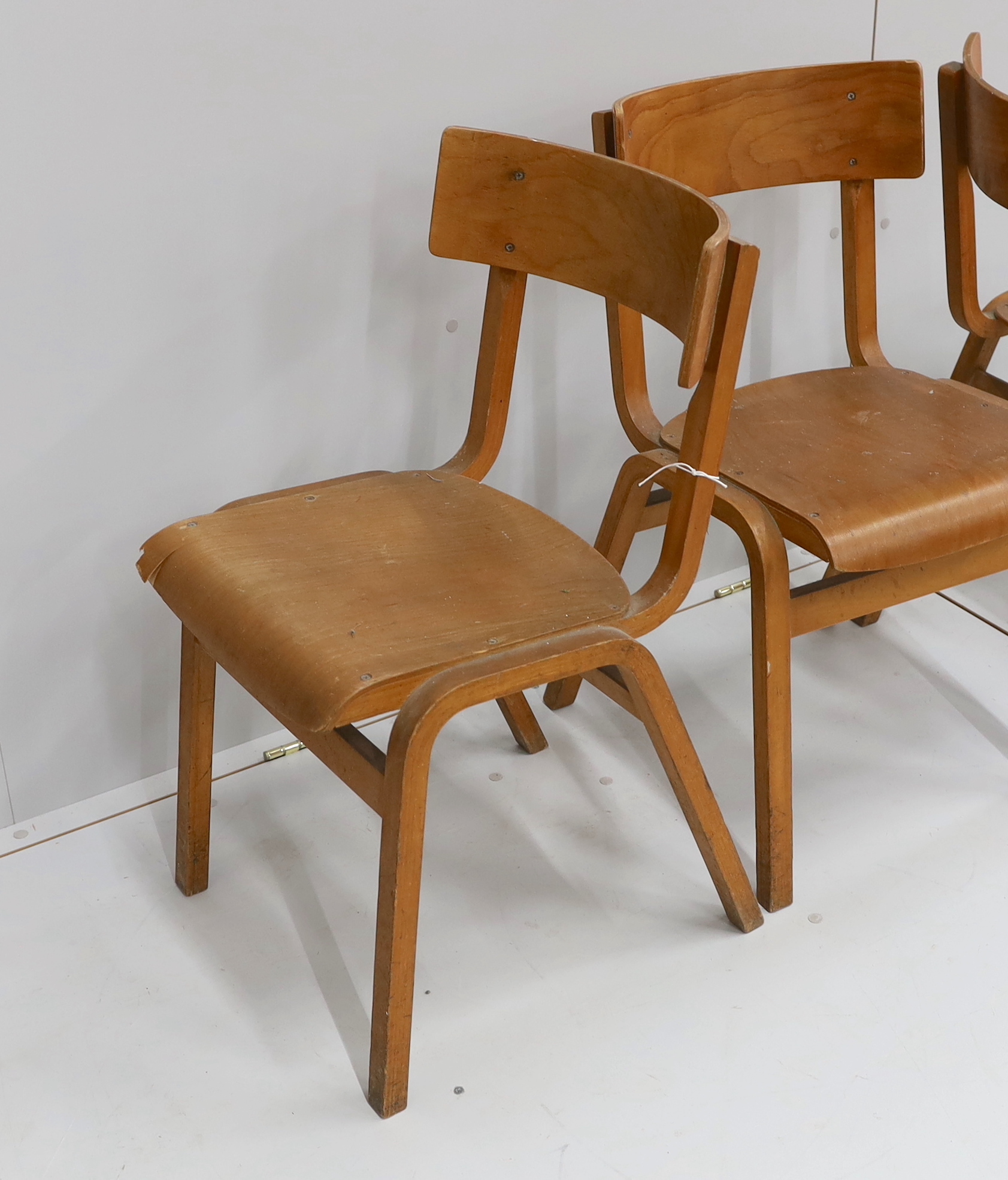 A set of three mid century bent ply chairs